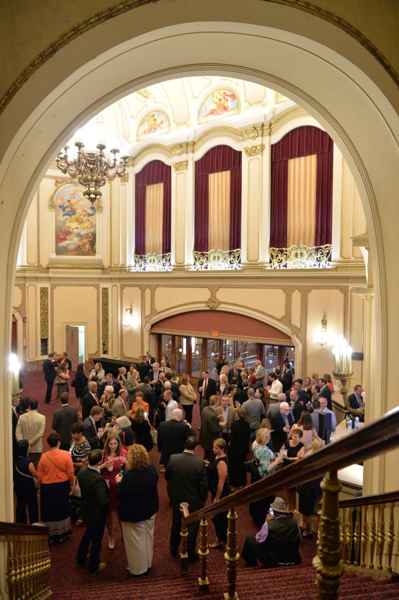 Crowd gathers in the lobby of the Palace Theatre 
