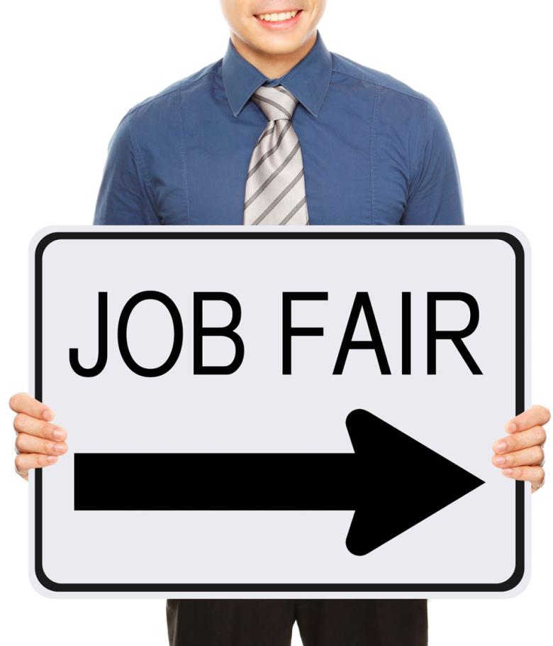 Stock photo of a man holding a sign meant to look like a street sign that is all white with a large black arrow pointing to the right and text that reads "Job Fair" 