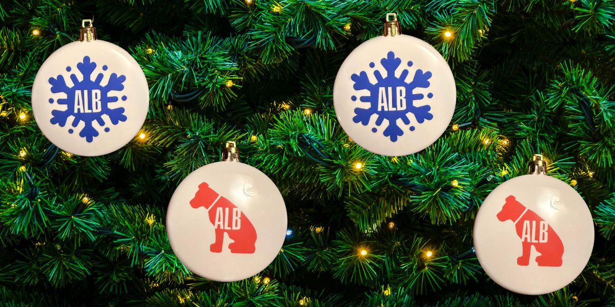 Image of snowflake ALB and dog ALB ornaments on Christmas Tree