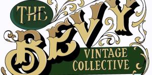 Gold and green logo reading The Bevy Vintage Collective