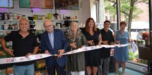 People cutting ribbon at the ceremony 