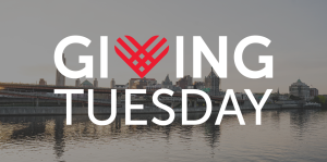 Image of downtown Albany waterfront with a Giving Tuesday overlay graphic on top