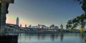 Panoramic photo of city of Albany featuring highways and Hudson River