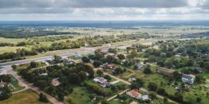 Aerial view of houses and farms and fields