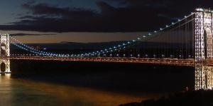 Suspension bridge lit up at night