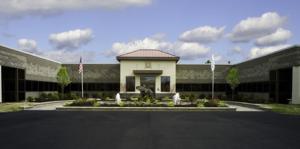 Large 3-sided building with Trustco logo on center entrance