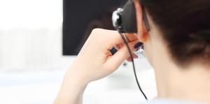 Back of woman with headset talking on phone