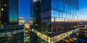 Blue highrise glass buildings reflecting the sky