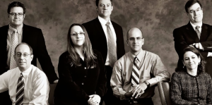 Sepia toned portrait of law firm employees