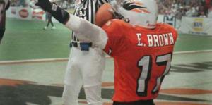 Arena football player celebrating a touchdown in the endzone