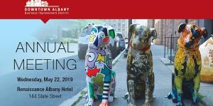 Annual meeting graphic with three painted nipper dogs and the BID logo on top in a red banner