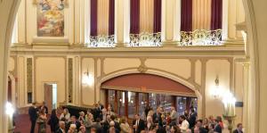 Crowd gathers in the lobby of the Palace Theatre 