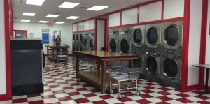 Empty laundromat with red and white checkered floors