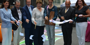 People cutting ribbon