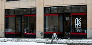 Exterior shot of Albany Center Gallery from the street, snow on the ground in front of it