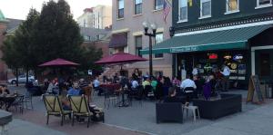 A packed outdoor patio in front of a Downtown Albany restaurant