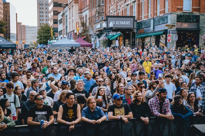 Crowd of people watching a concert at PearlPalooza 2023 on N Pearl Street