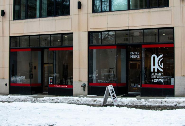 Exterior shot of Albany Center Gallery from the street, snow on the ground in front of it