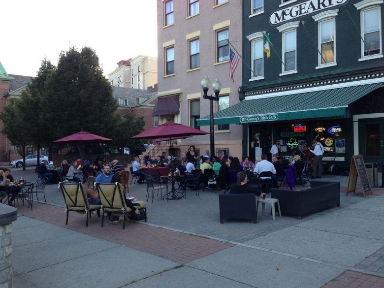 A packed outdoor patio in front of a Downtown Albany restaurant